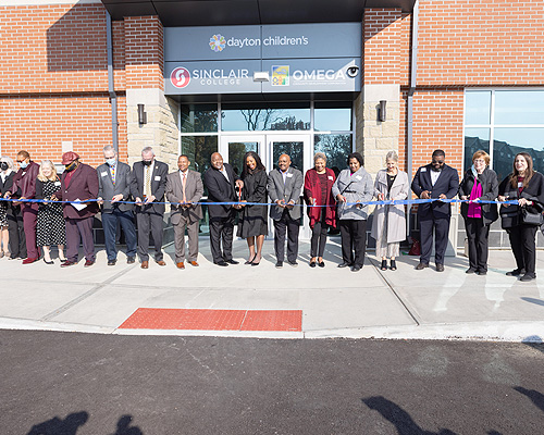 people at a ribbon cutting ceremony for the hope center